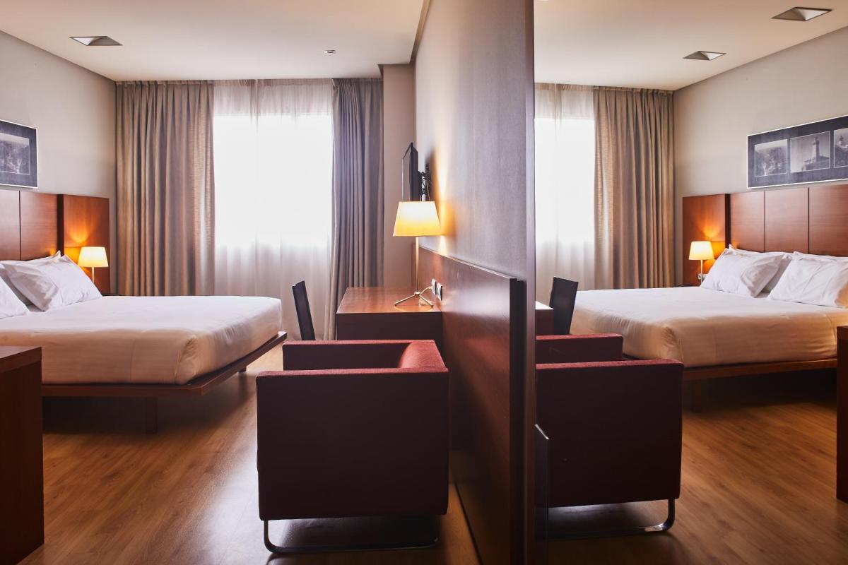 Cama o camas de una habitación en Silken Ciudad Gijón
