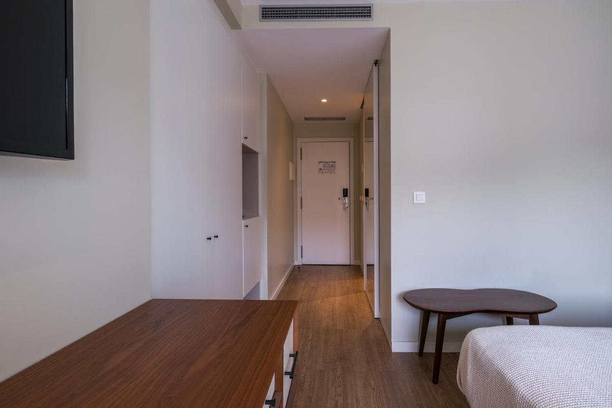 Uma cama ou camas num quarto em Hotel Vouga