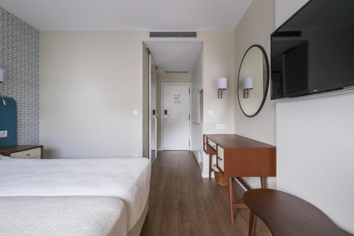 Uma televisão e/ou sistema de entretenimento em Hotel Vouga