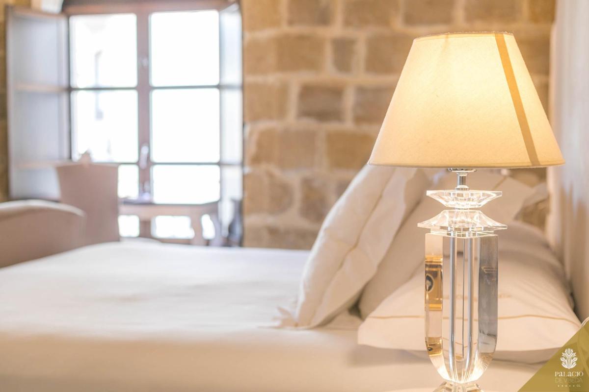 Cama o camas de una habitación en Hotel Palacio De Úbeda 5 G.L
