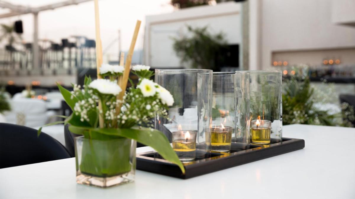 a tray with candles and flowers on a table at InterContinental Marine Drive Mumbai by IHG in Mumbai