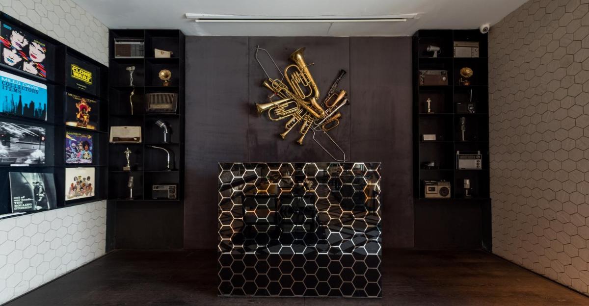 a room with a wine rack and a clock on the wall at InterContinental Marine Drive Mumbai by IHG in Mumbai