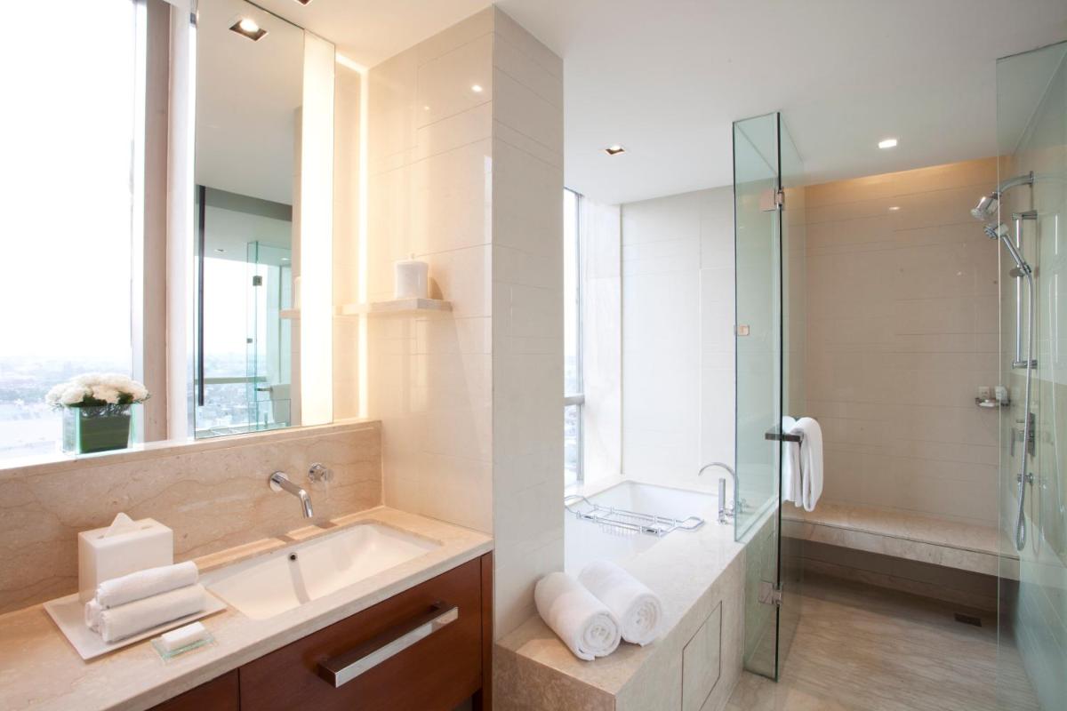 a bathroom with a sink and a glass shower at Hyatt Regency Amritsar Hotel & Spa in Amritsar