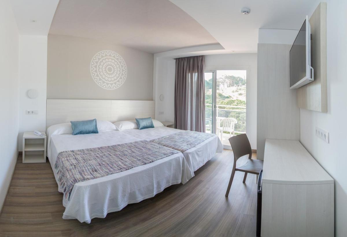 Cama o camas de una habitación en Hotel Oasis Park Splash