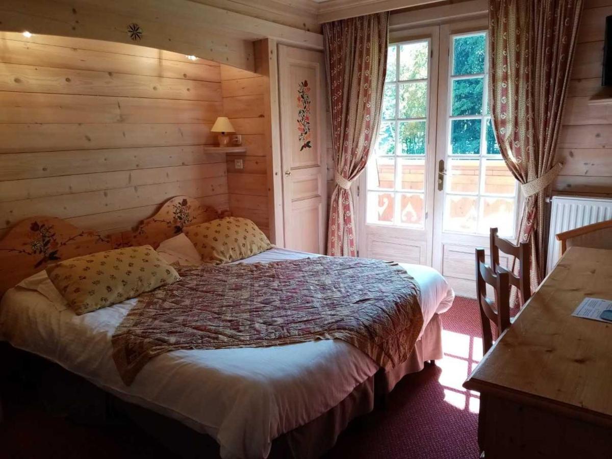 Un ou plusieurs lits dans un hébergement de l'établissement Hotel les Sapins