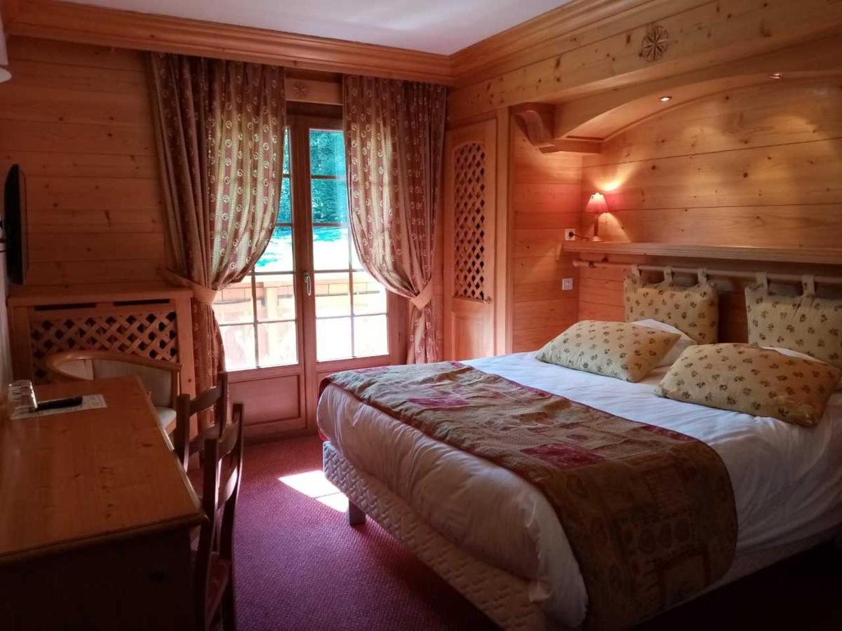 Un ou plusieurs lits dans un hébergement de l'établissement Hotel les Sapins