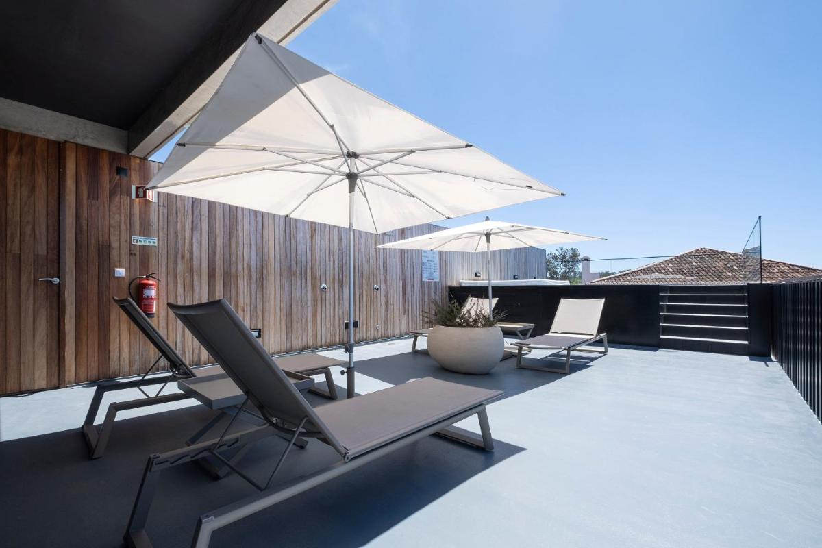 Uma varanda ou terraço em Aqua - Pópulo Eco Village