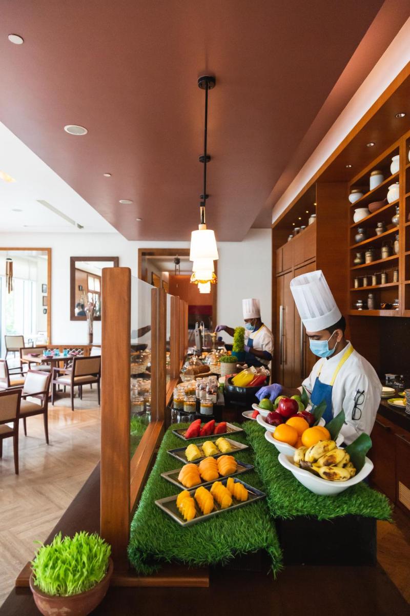 a buffet with fruits and vegetables on a table at Park Hyatt Chennai in Chennai