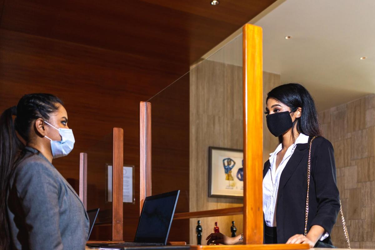 a man and a woman wearing a mask at Park Hyatt Chennai in Chennai