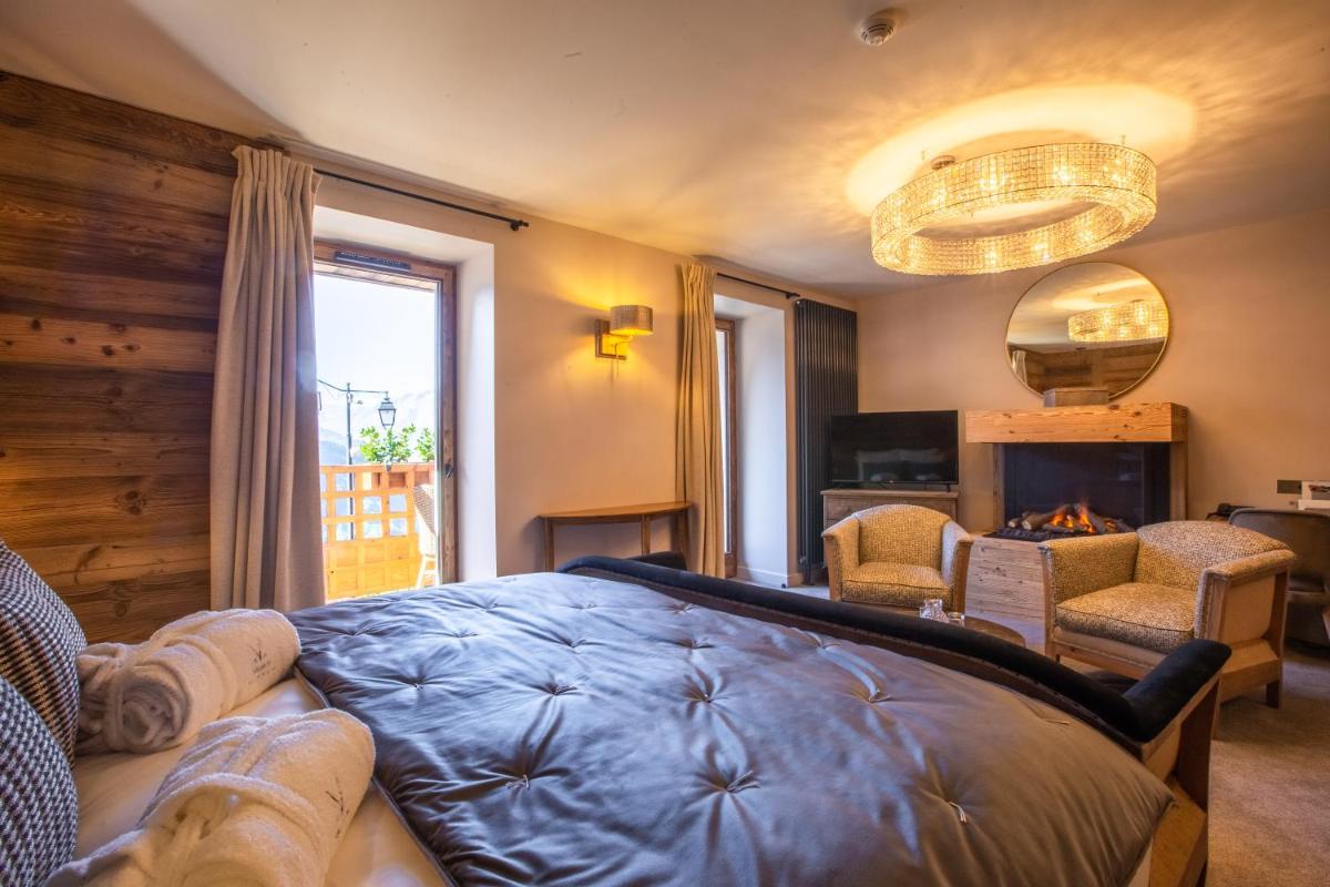 Un ou plusieurs lits dans un hébergement de l'établissement Hotel Le V de Vaujany