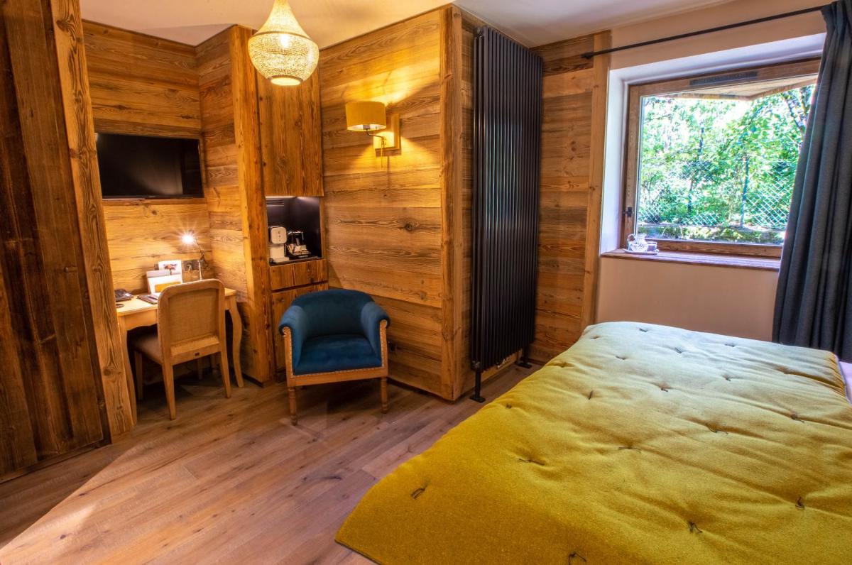 Un ou plusieurs lits dans un hébergement de l'établissement Hotel Le V de Vaujany