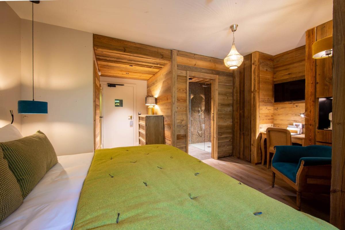 Télévision ou salle de divertissement dans l'établissement Hotel Le V de Vaujany