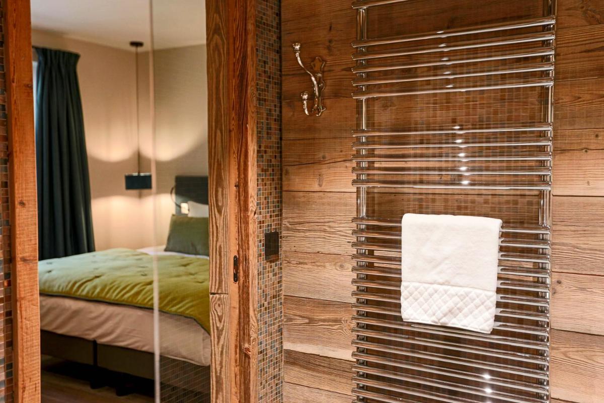 Un ou plusieurs lits dans un hébergement de l'établissement Hotel Le V de Vaujany