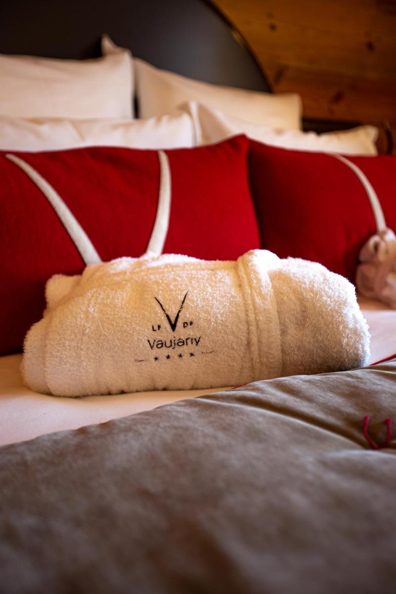 Un ou plusieurs lits dans un hébergement de l'établissement Hotel Le V de Vaujany