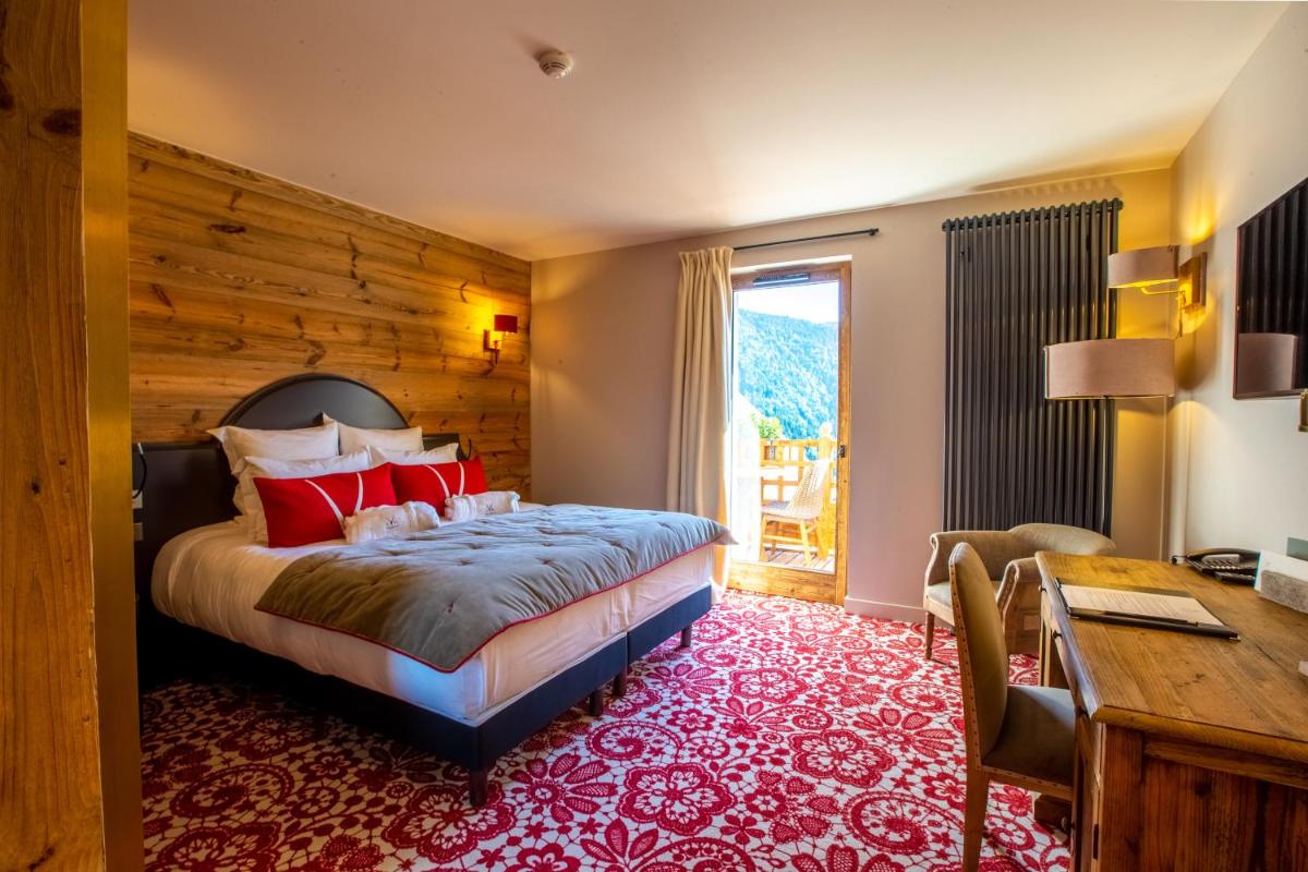 Un ou plusieurs lits dans un hébergement de l'établissement Hotel Le V de Vaujany