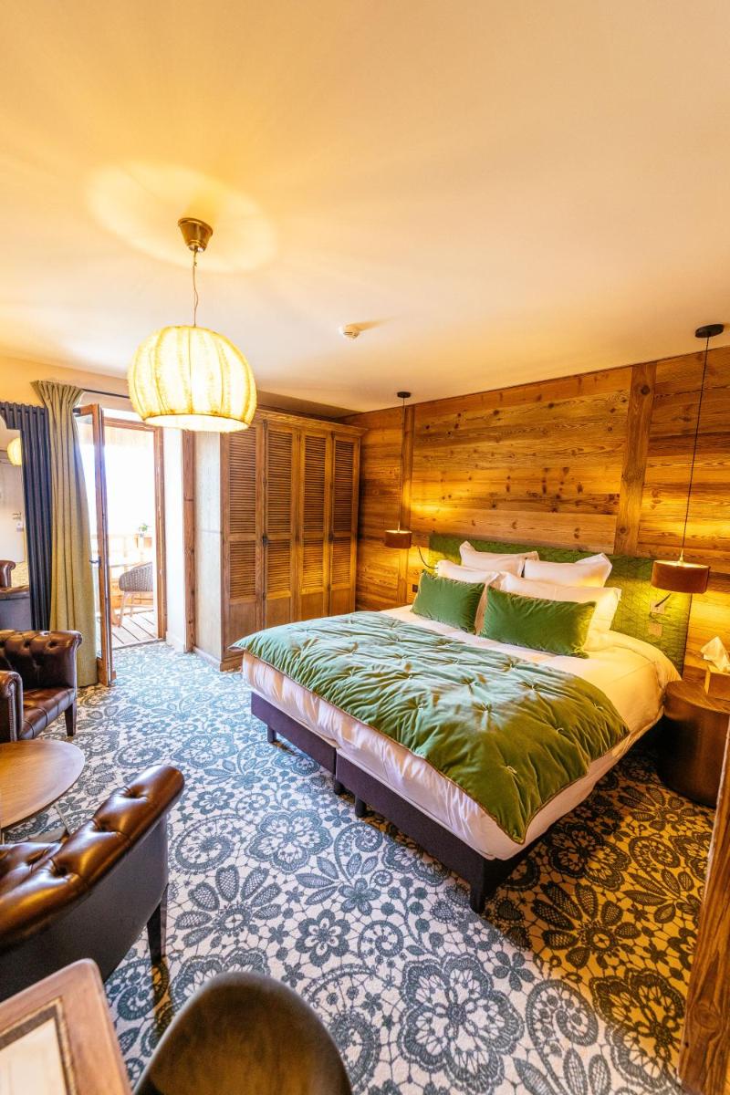 Un ou plusieurs lits dans un hébergement de l'établissement Hotel Le V de Vaujany