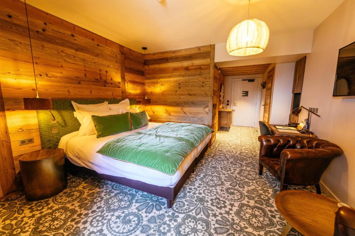 Un ou plusieurs lits dans un hébergement de l'établissement Hotel Le V de Vaujany