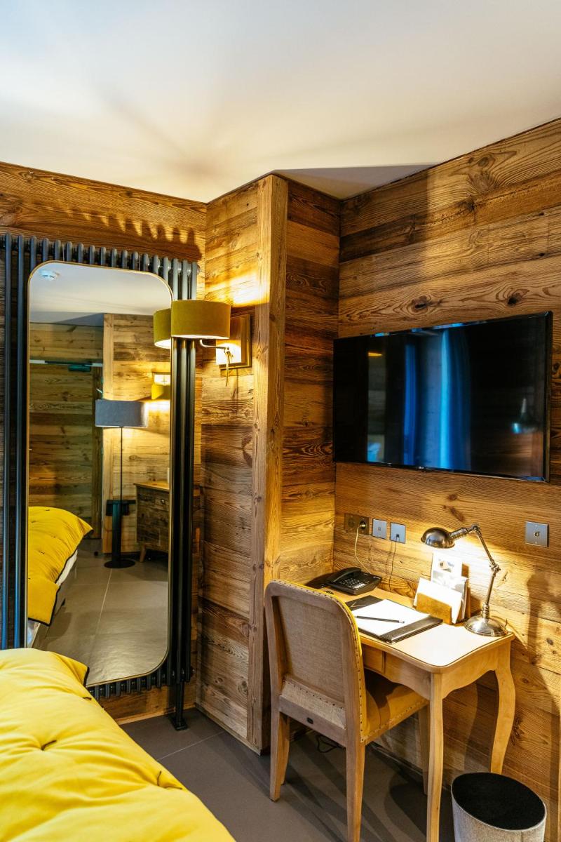 Coin salon dans l'établissement Hotel Le V de Vaujany