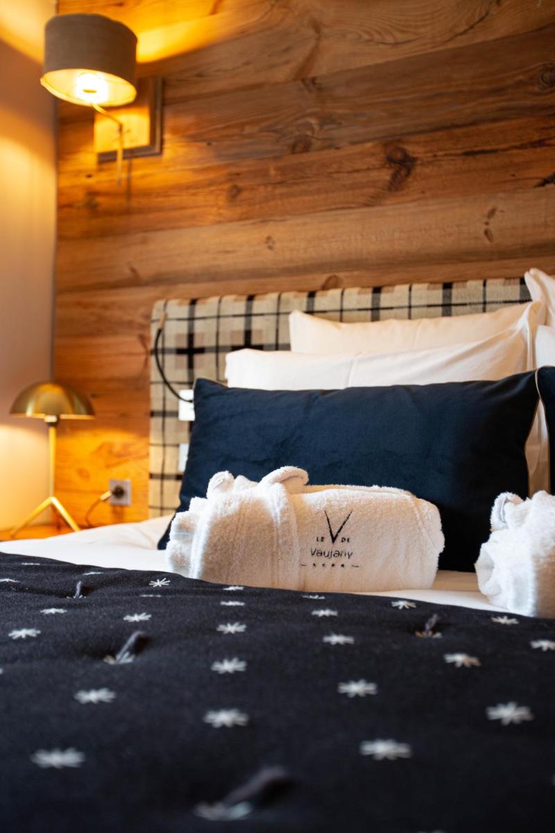 Un ou plusieurs lits dans un hébergement de l'établissement Hotel Le V de Vaujany