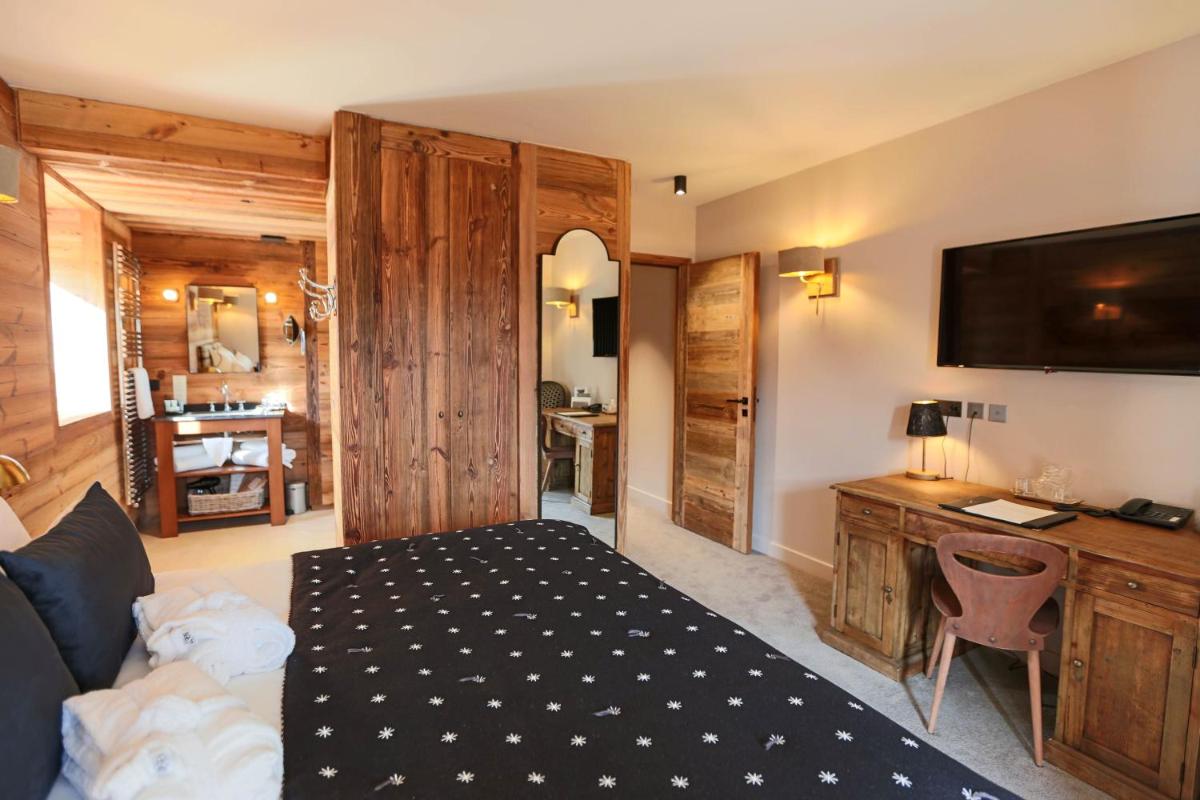 Un ou plusieurs lits dans un hébergement de l'établissement Hotel Le V de Vaujany