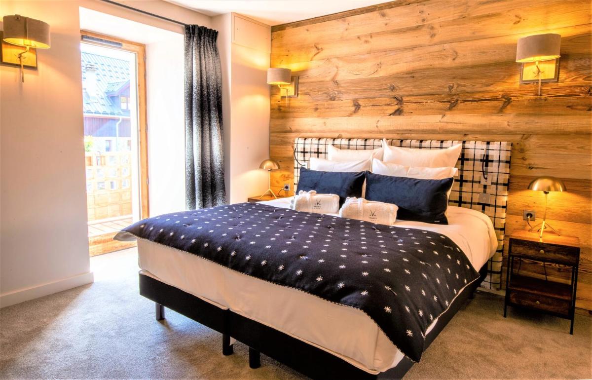 Un ou plusieurs lits dans un hébergement de l'établissement Hotel Le V de Vaujany