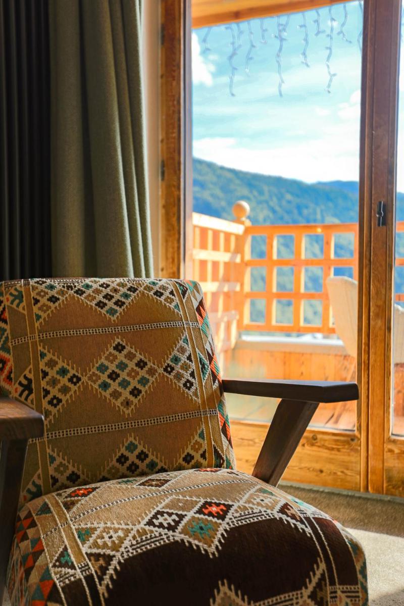 Coin salon dans l'établissement Hotel Le V de Vaujany