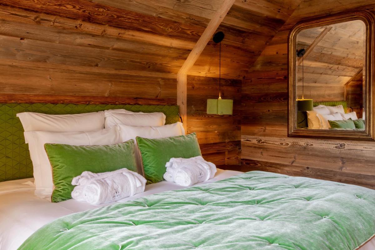 Un ou plusieurs lits dans un hébergement de l'établissement Hotel Le V de Vaujany