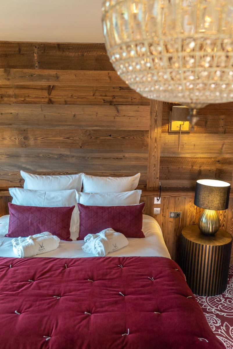 Un ou plusieurs lits dans un hébergement de l'établissement Hotel Le V de Vaujany