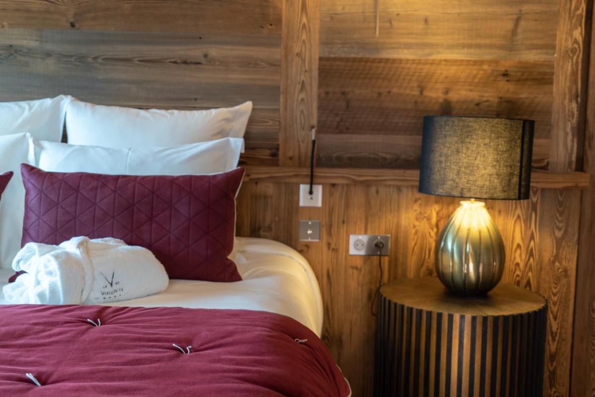 Un ou plusieurs lits dans un hébergement de l'établissement Hotel Le V de Vaujany
