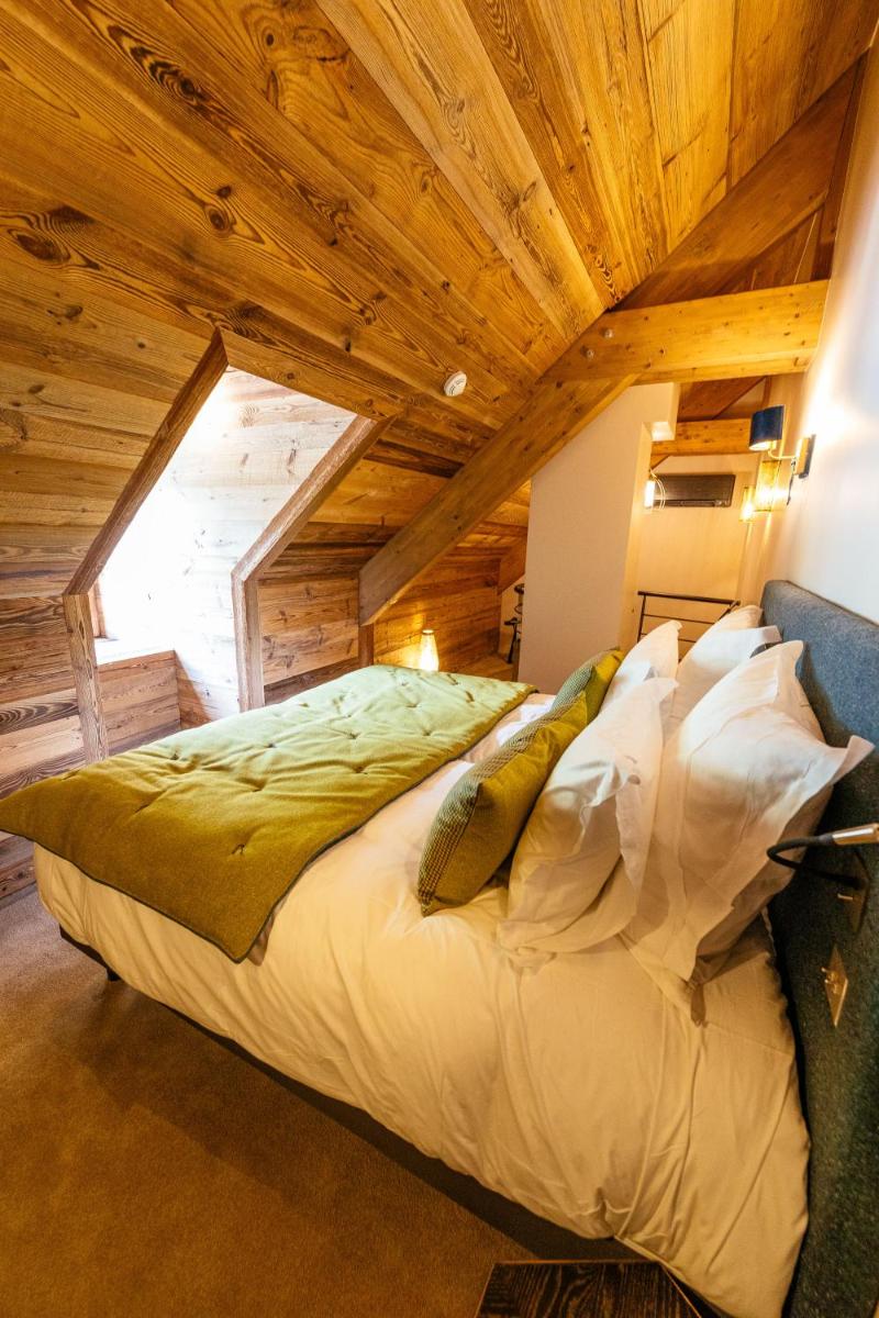 Un ou plusieurs lits dans un hébergement de l'établissement Hotel Le V de Vaujany