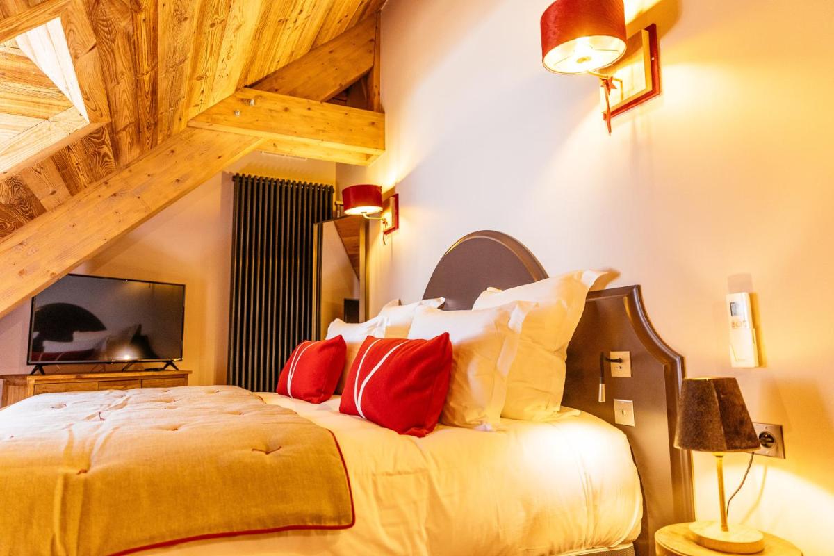 Télévision ou salle de divertissement dans l'établissement Hotel Le V de Vaujany