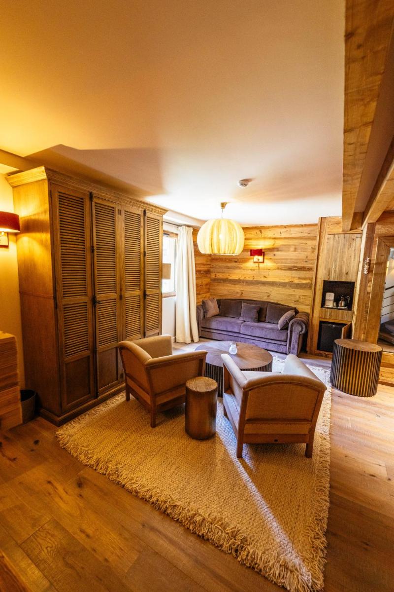 Coin salon dans l'établissement Hotel Le V de Vaujany