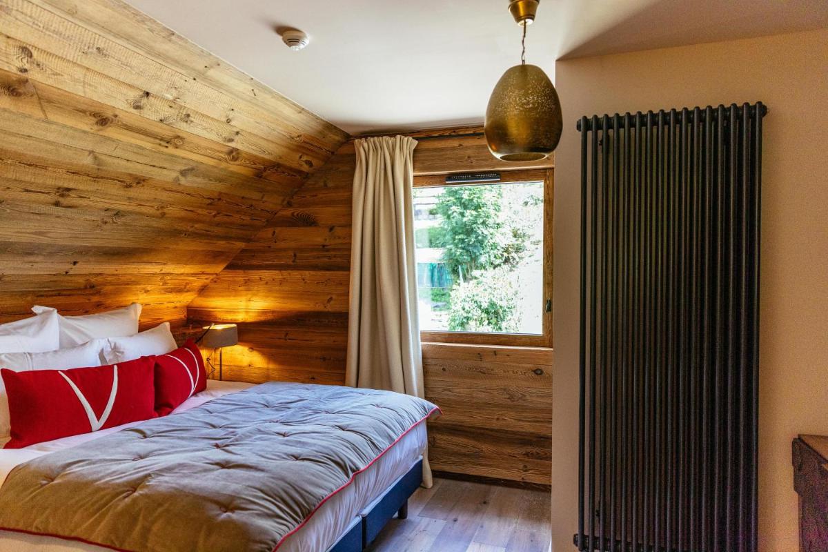 Un ou plusieurs lits dans un hébergement de l'établissement Hotel Le V de Vaujany