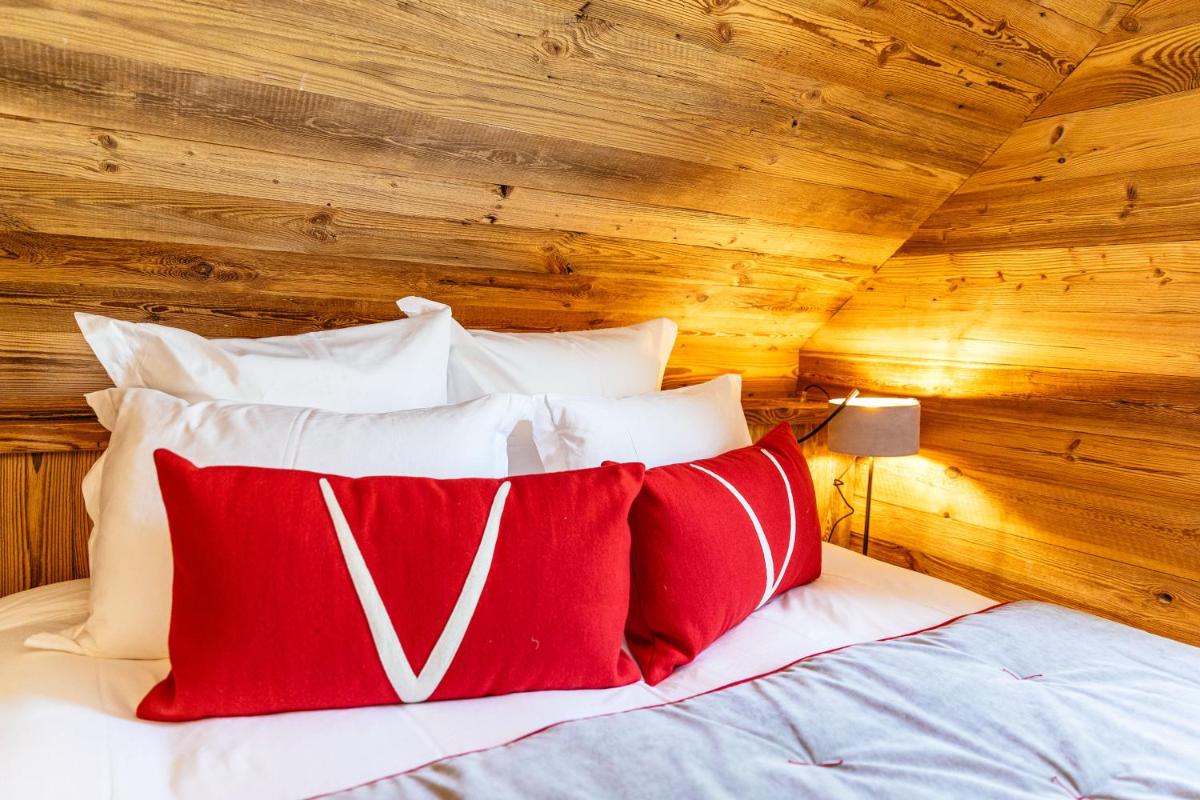Un ou plusieurs lits dans un hébergement de l'établissement Hotel Le V de Vaujany