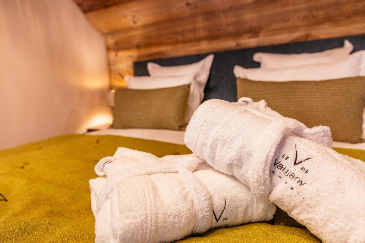 Un ou plusieurs lits dans un hébergement de l'établissement Hotel Le V de Vaujany