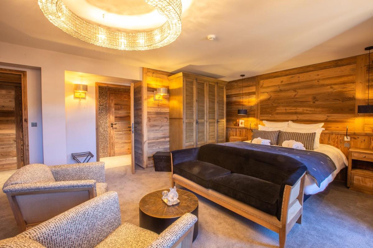 Un ou plusieurs lits dans un hébergement de l'établissement Hotel Le V de Vaujany