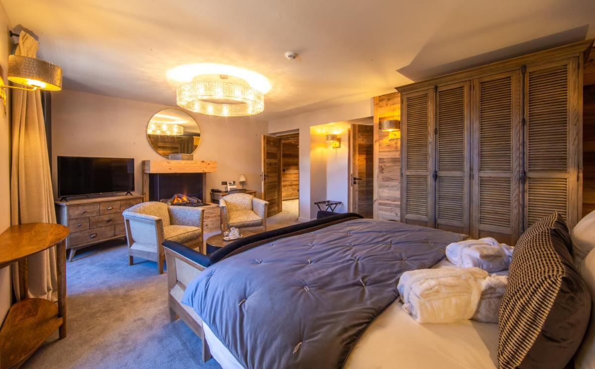 Télévision ou salle de divertissement dans l'établissement Hotel Le V de Vaujany