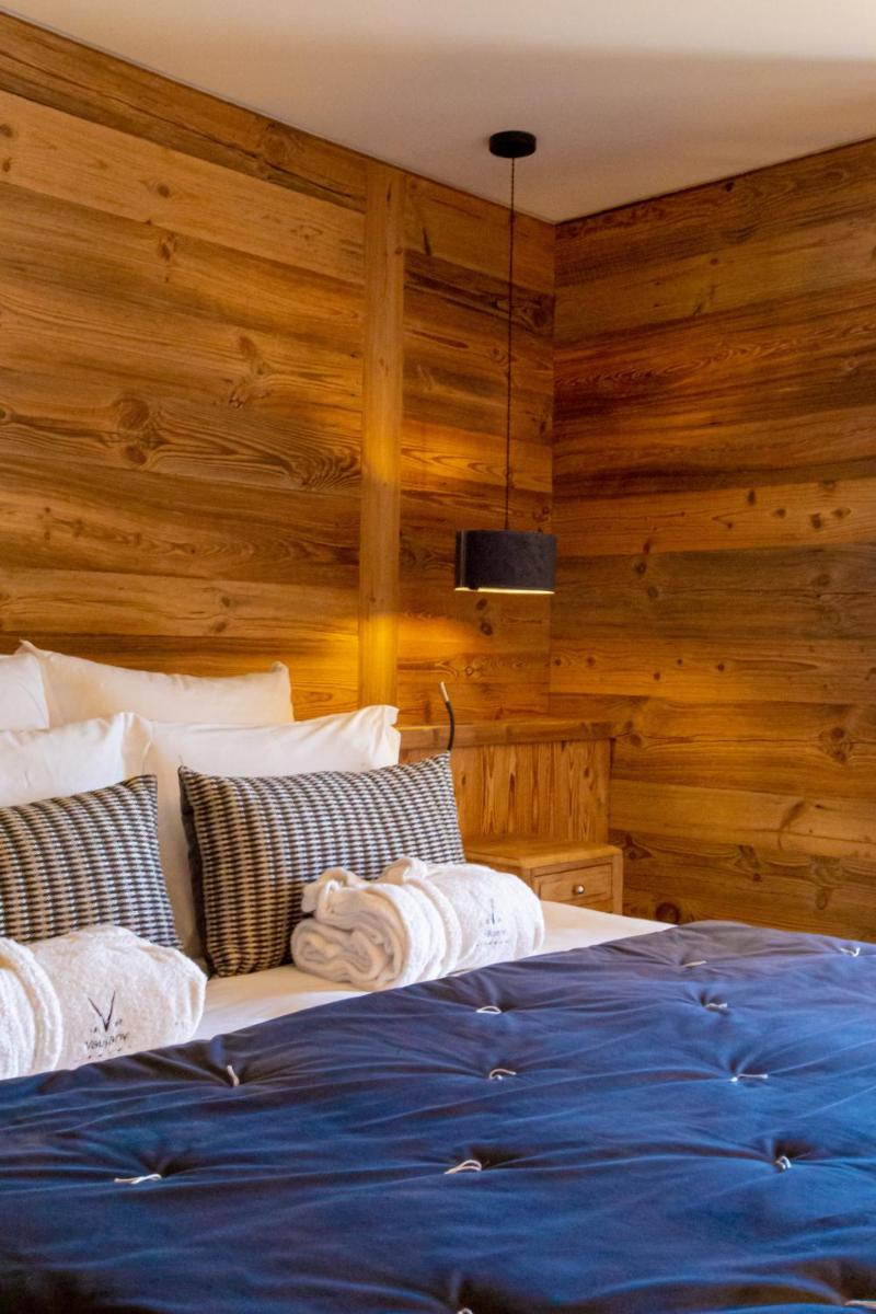 Un ou plusieurs lits dans un hébergement de l'établissement Hotel Le V de Vaujany