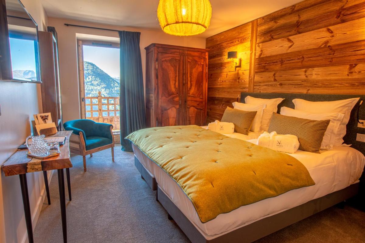 Un ou plusieurs lits dans un hébergement de l'établissement Hotel Le V de Vaujany