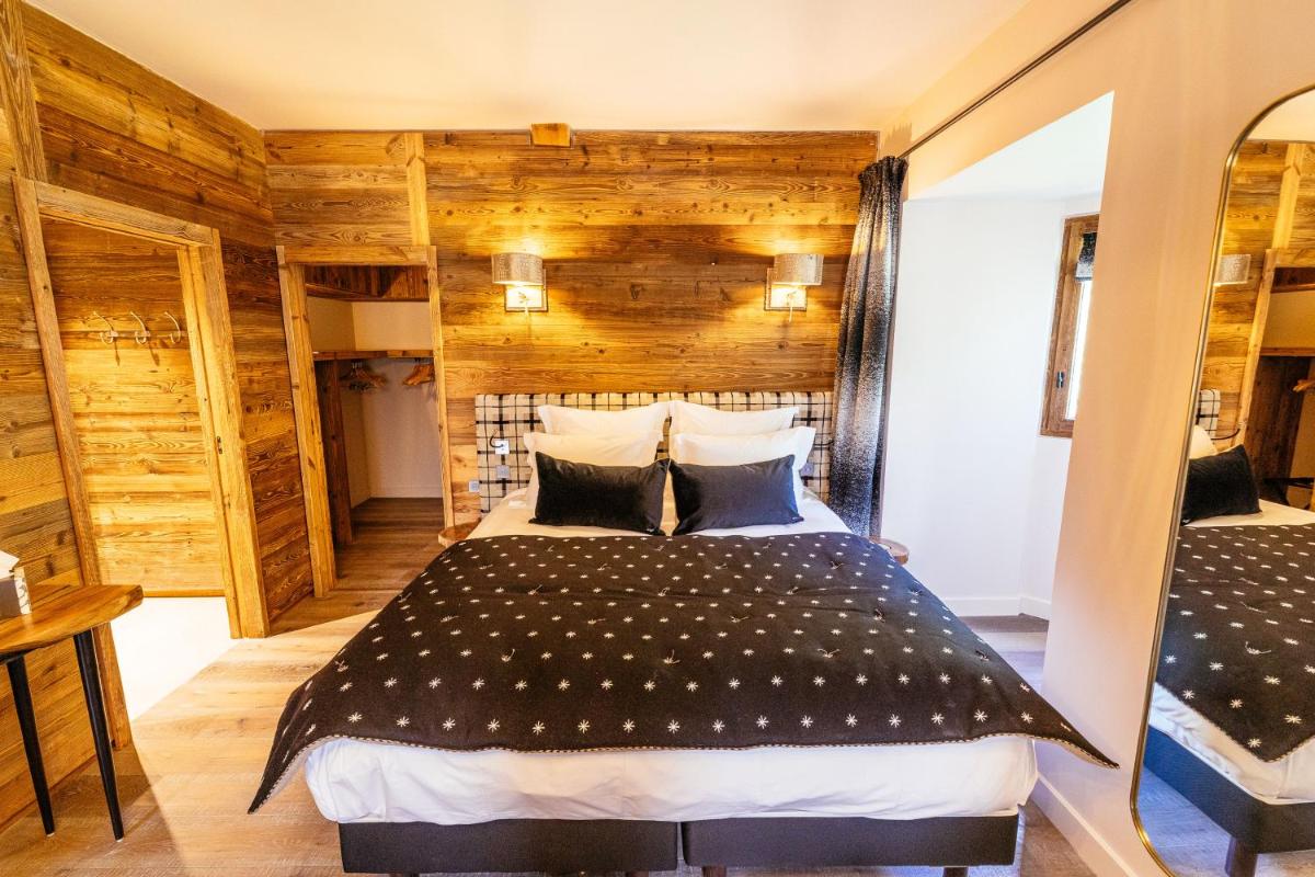 Un ou plusieurs lits dans un hébergement de l'établissement Hotel Le V de Vaujany