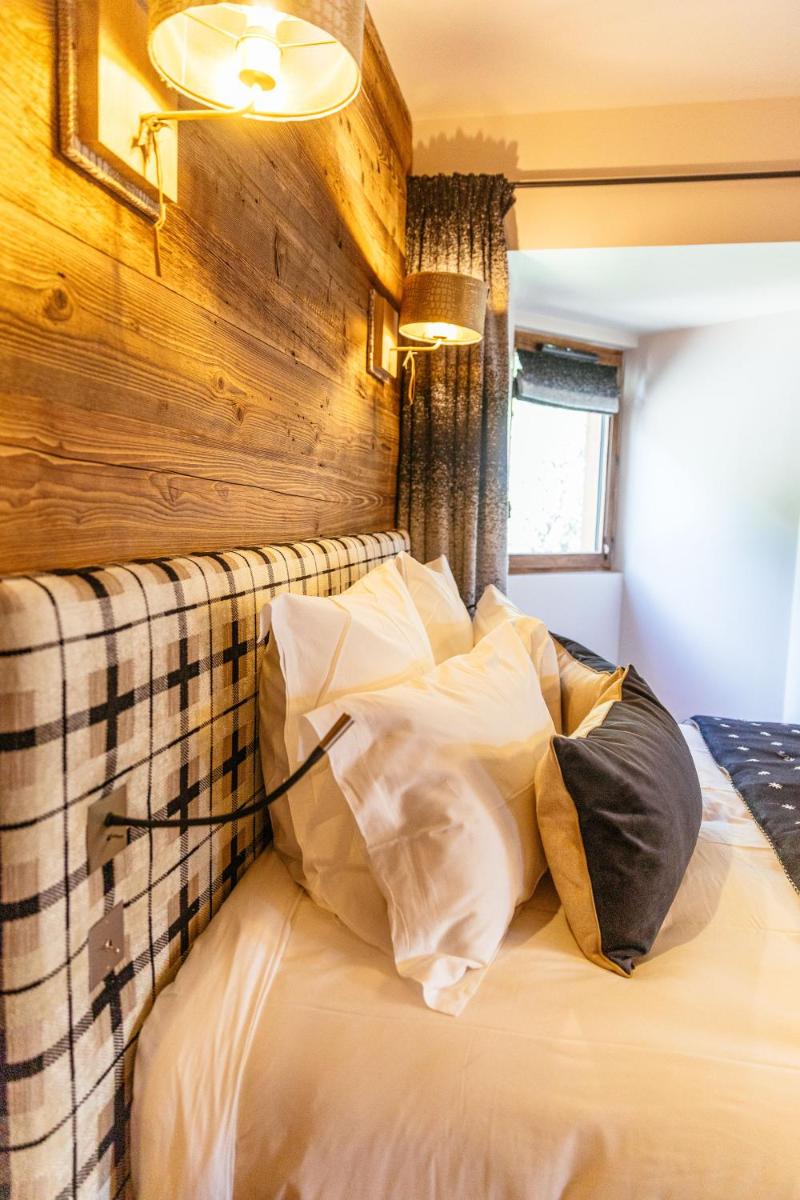 Un ou plusieurs lits dans un hébergement de l'établissement Hotel Le V de Vaujany