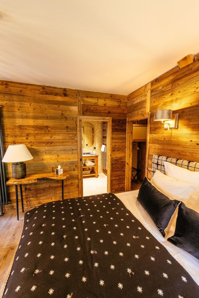 Un ou plusieurs lits dans un hébergement de l'établissement Hotel Le V de Vaujany