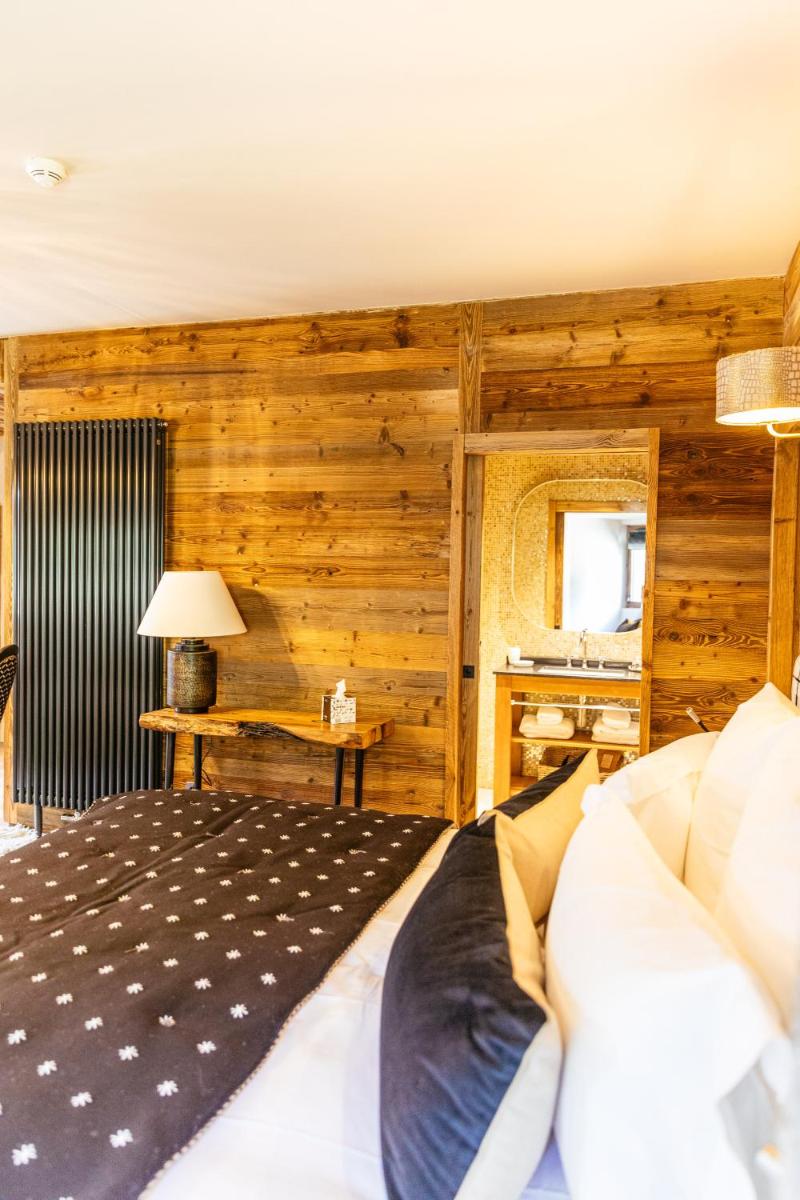 Un ou plusieurs lits dans un hébergement de l'établissement Hotel Le V de Vaujany