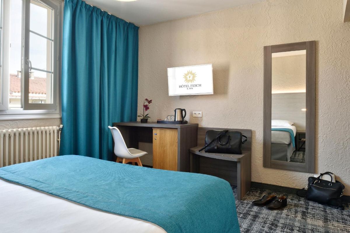 Un ou plusieurs lits dans un hébergement de l'établissement Hôtel Fesch & Spa