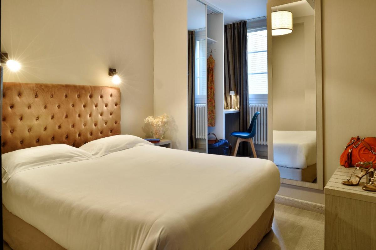 Un ou plusieurs lits dans un hébergement de l'établissement Hôtel Fesch & Spa