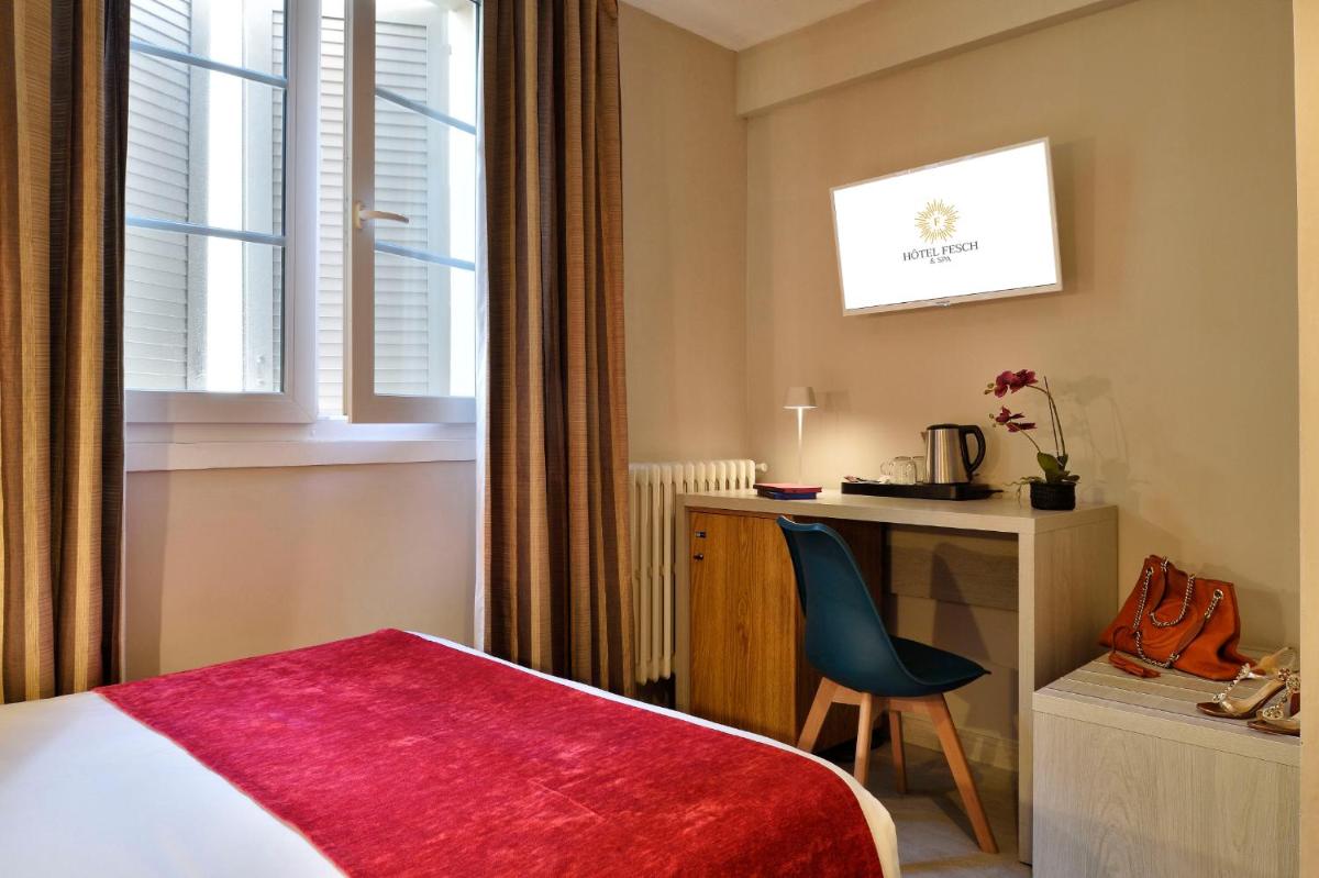 Un ou plusieurs lits dans un hébergement de l'établissement Hôtel Fesch & Spa