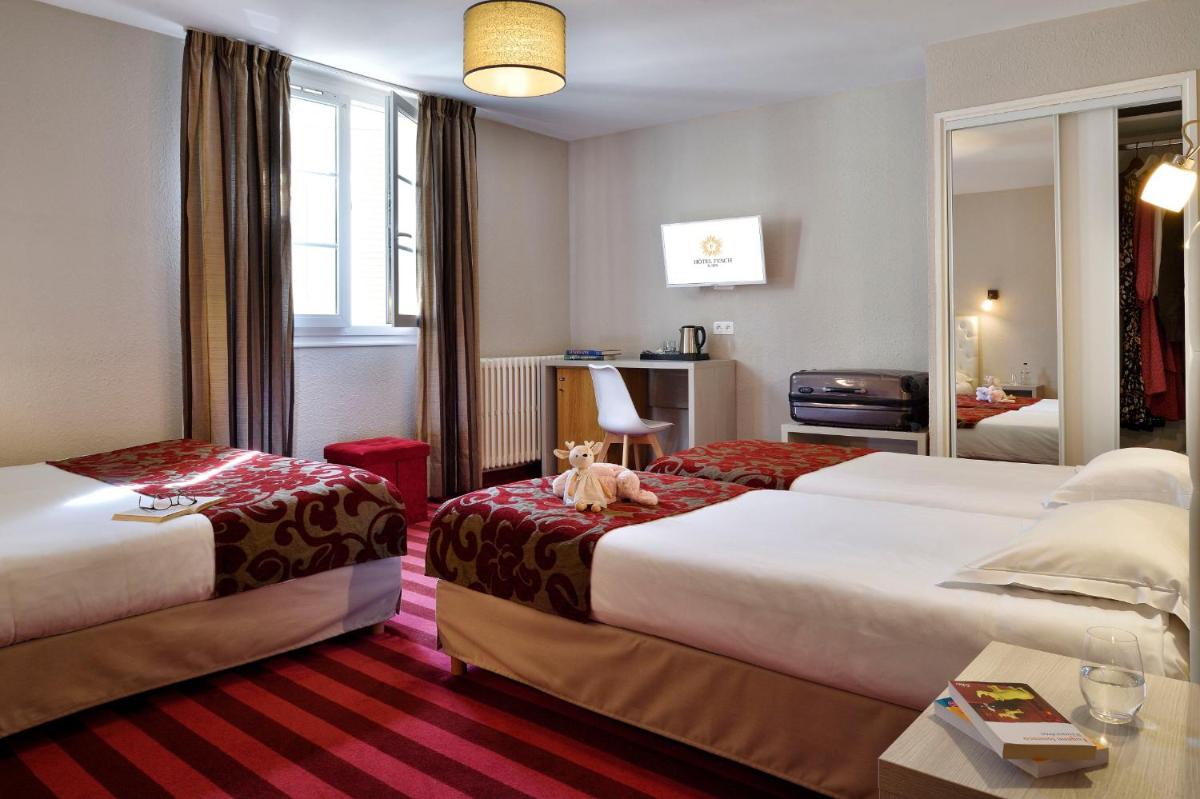 Un ou plusieurs lits dans un hébergement de l'établissement Hôtel Fesch & Spa