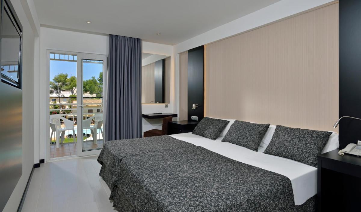 Cama o camas de una habitación en Hotel Hispania