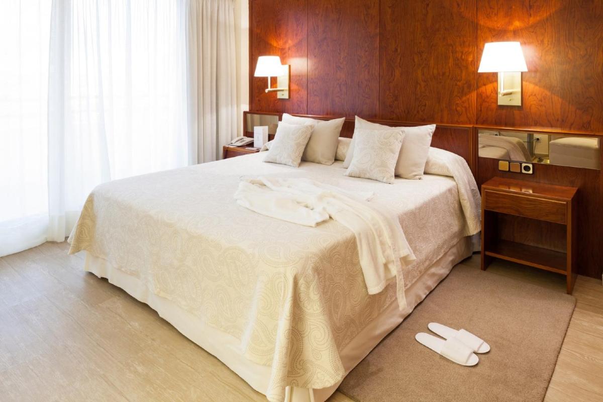 Cama o camas de una habitación en Hotel Royal Plaza