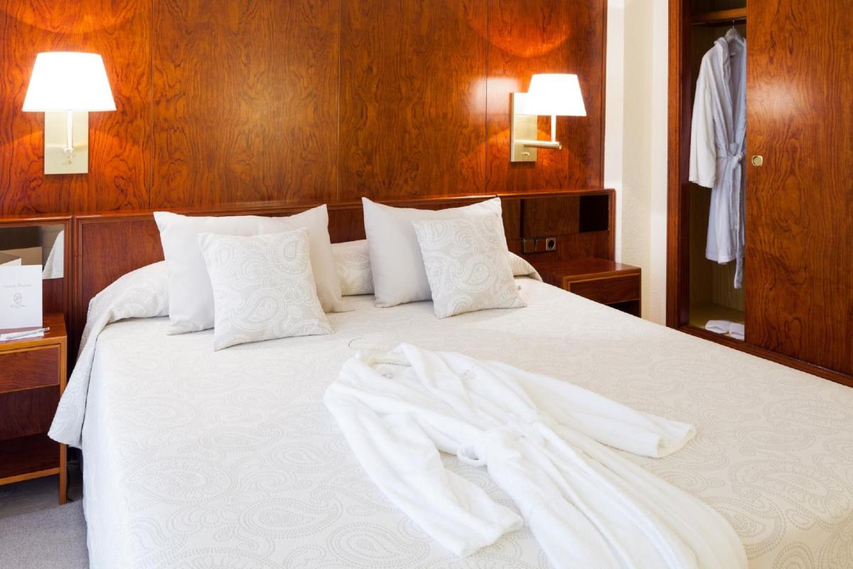 Cama o camas de una habitación en Hotel Royal Plaza